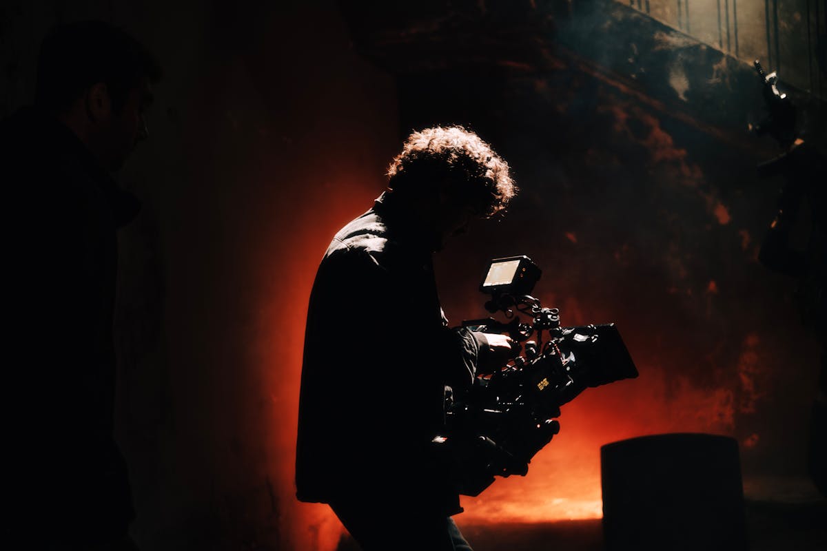 Cinematographer on set with dramatic lighting